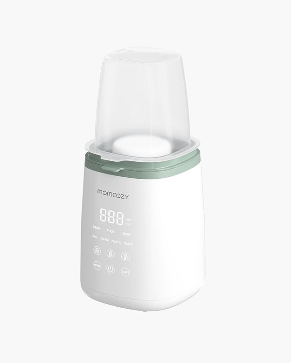 Momcozy 6-in-1 Fast Baby Bottle Warmer with digital display, green top, and protective cover for warming bottles, heating food, and thawing frozen milk