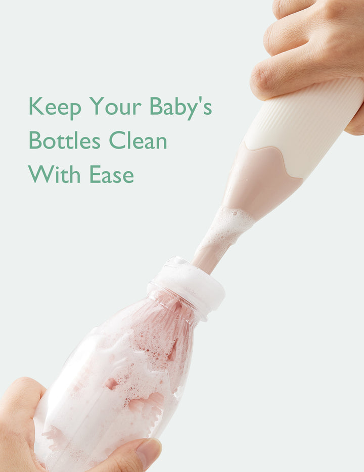 Momcozy bottle brush effortlessly cleaning a baby bottle with foaming solution.