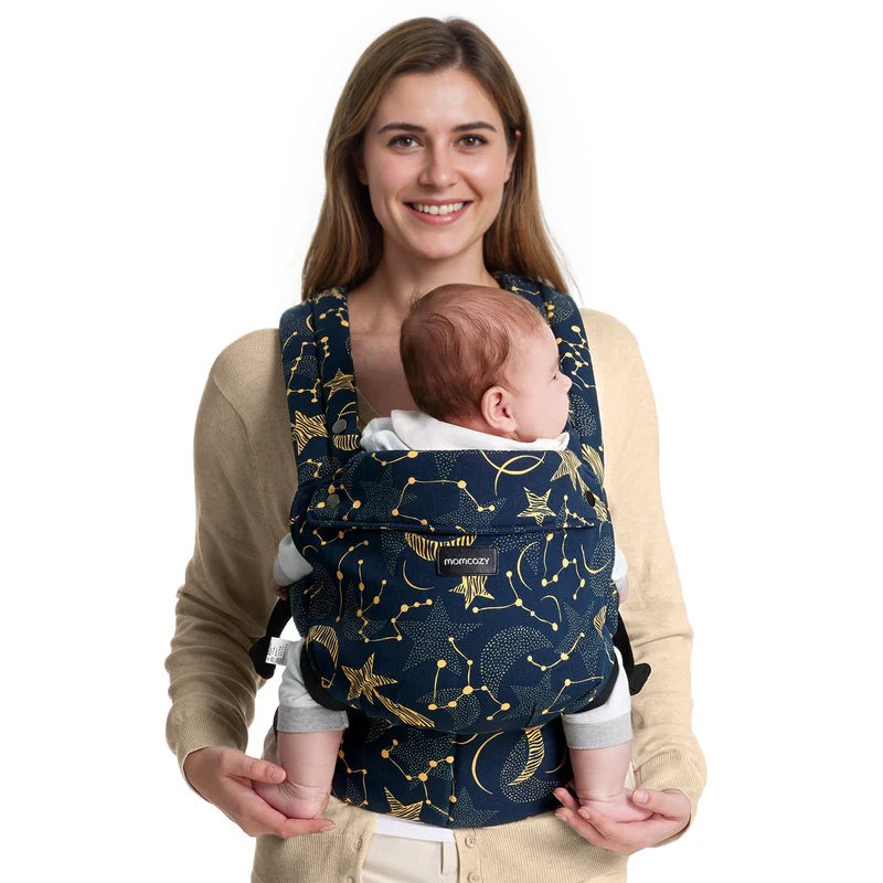 Momcozy PureHug baby carrier in navy blue with stars and constellation pattern, comfortable babywearing design for newborns.