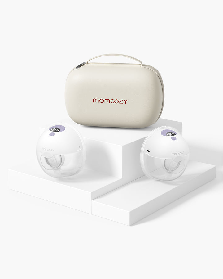 Momcozy M5 Wearable Breast Pump and storage case on a stylish white display pedestal.