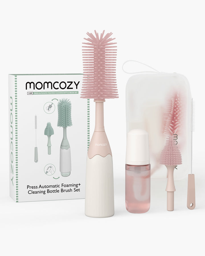 Momcozy automatic foaming bottle brush kit with cleaning solution and accessories in light colors.