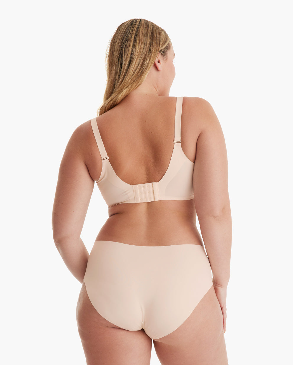 Light peach YN21 Seamless Nursing Bra, rear view. Model highlights wide adjustable straps & multi-hook closure.